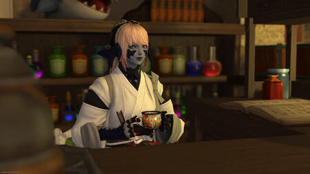 Sarnai in her office attire sitting at her desk, enjoying a hot drink. She has pink hair in a high ponytail with bangs, light blue skin, pink eyes, and dark blue scales covering much of her face. Behind her are shelves containing medicine.